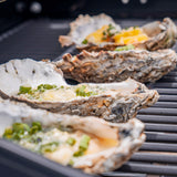 Four Carlsbad Kraken Oysters on the barbeque